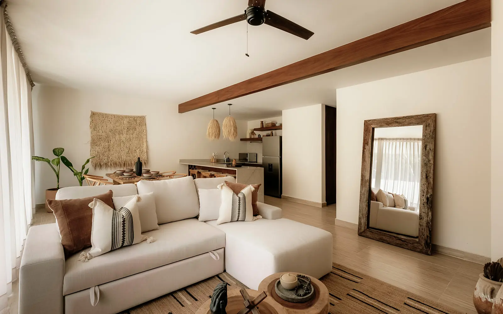 Modern open plan living and dining room in Tulum designer condo